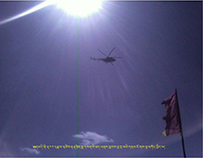 Helicopter flys over Ngaba kirti Monastery on March 22, 2008